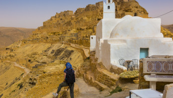 A lone tourist explores what's left of tourist village Chenini, Tunisia [Getty]