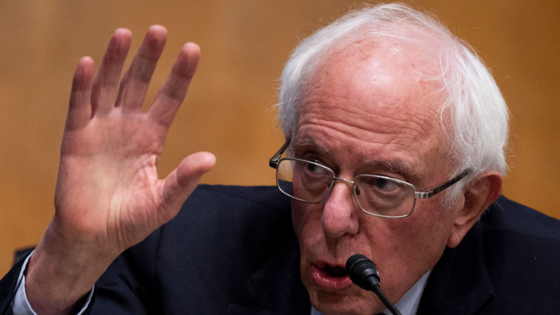 Bernie Sanders speaking with his hand raised