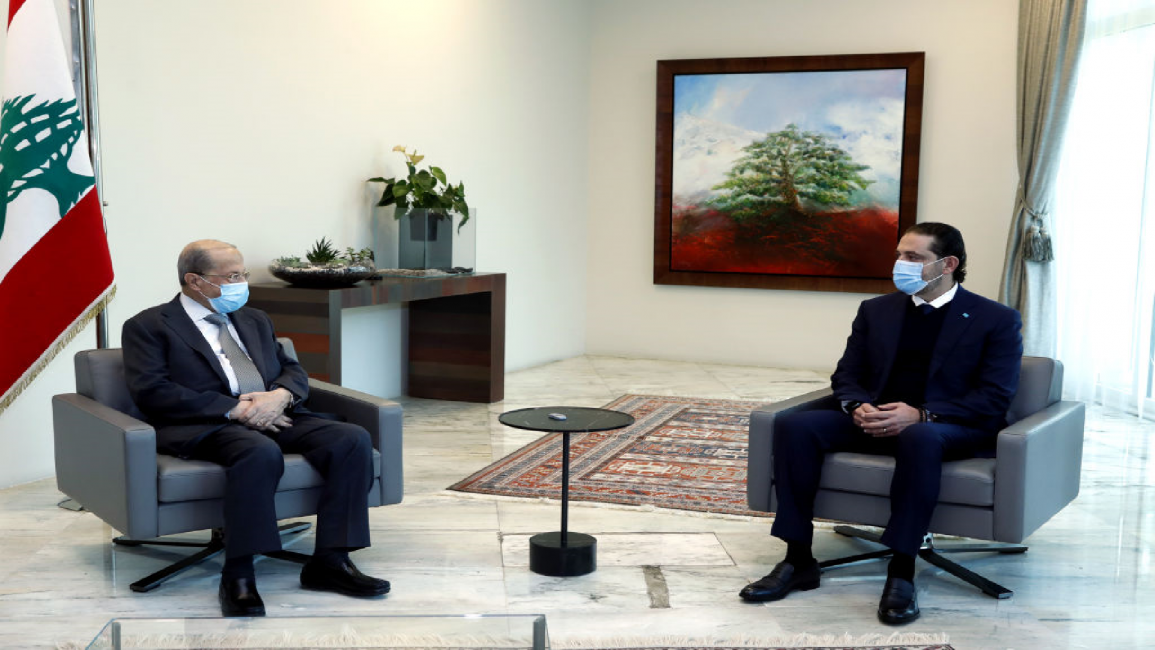 Lebanese President Michel Aoun (L) and prime minister-designate Saad Hariri
