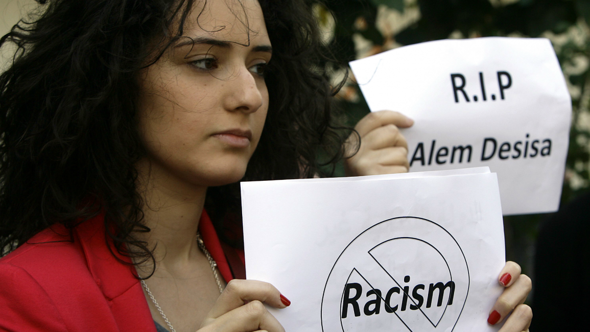 A Lebanese activist protests against racism