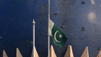 Pakistani flag flying at half-mast
