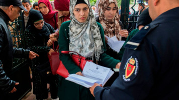 Moroccan women arrive to sit an exam on May 6, 2018, in the capital Rabat, to become a notary in Islamic law, known locally as an "Adoul", after the position was opened to women for the first time in Morocco [Getty Images]