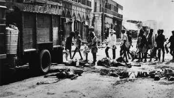 Victims of the riots in Delhi being removed from the streets. Fighting broke out over Partition. (Photo by Keystone/Getty Images)