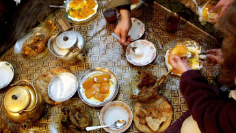 Thanksgiving dinner is served at Sufi Mumim's restaurant November 22, 2001 in Talaquan, Afghanistan. Prepared dishes include roast turkey with pumpkin and yoghurt and Afghan staples such as sweet green tea and bread