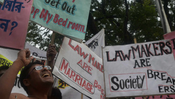 Indian social activists protest a new marriage bill