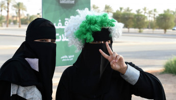 Saudi women football matches and car showroom - Getty