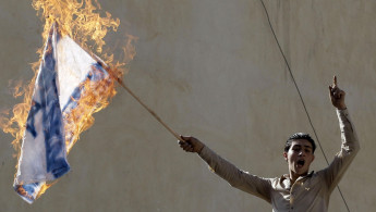 Jordan BDS flag burning - AFP