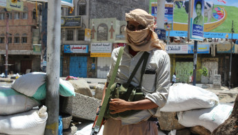 Yemeni 'People's Resistance' group stand guard in Taiz
