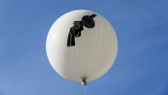 Balloon gun protest germany - corbis - 2015