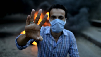 Rabaa anniversary [AFP]