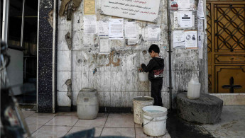 Douma boy Damascus water AFP