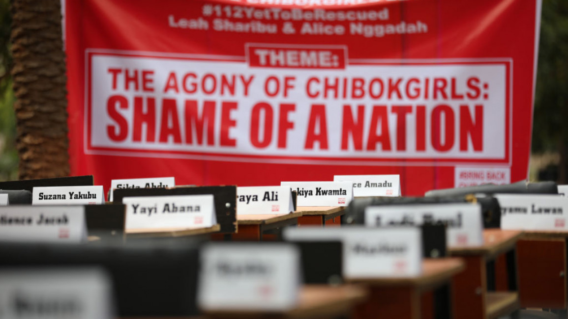 A banner for and the names of Nigeria's remaining Chibok girls.