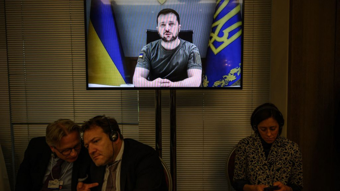 Ukraine's President Volodymyr Zelensky shown on a TV screen.