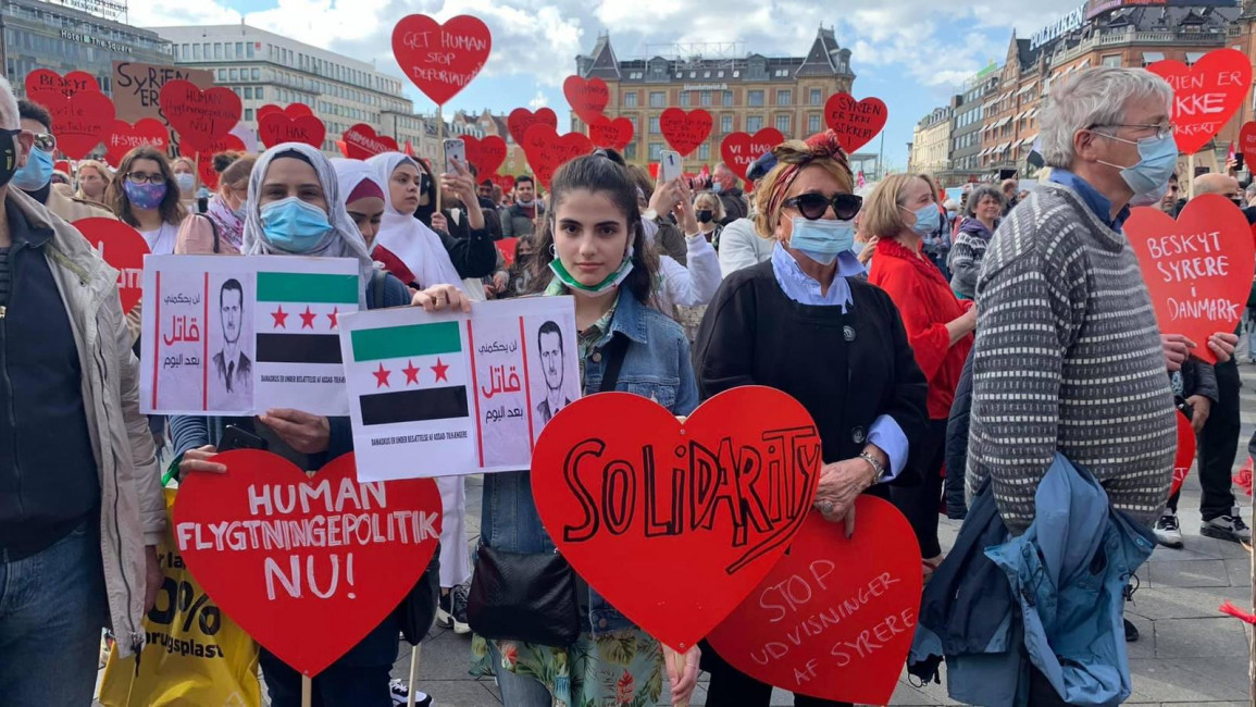 Dozens of Syrians and their supporters have protested outside the Danish parliament [Ahmed Kazkaz] 