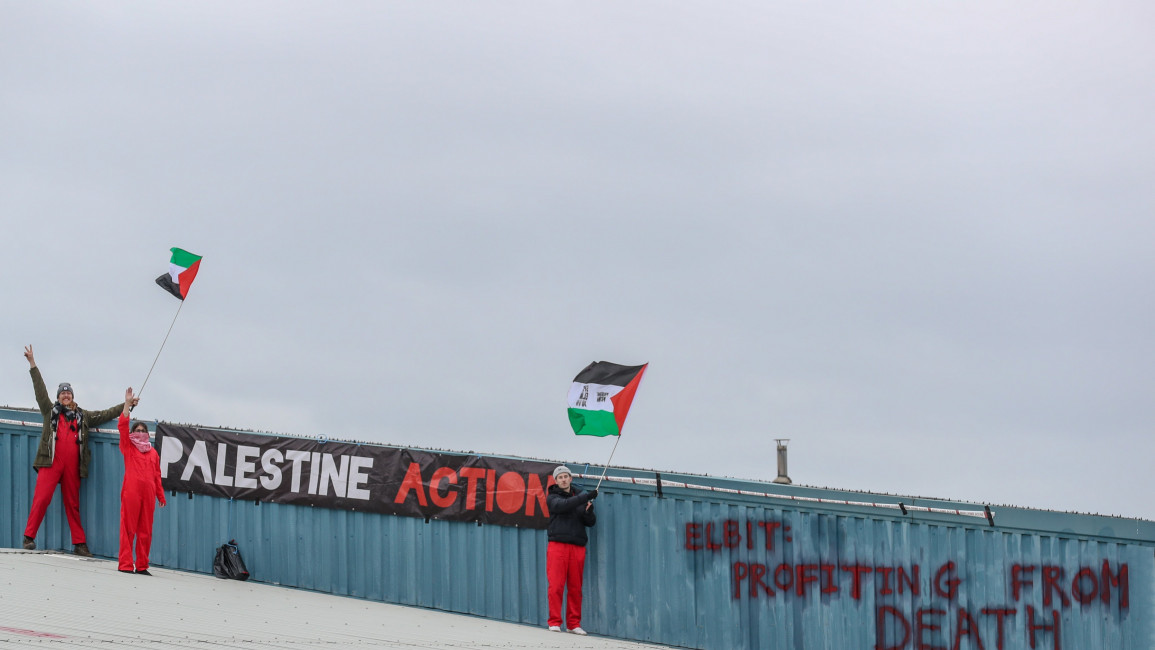 Activists from Palestine Action of the roof of Elbit's Elite KL factory in Tamworth, Staffordshire [Vudi Xhymshiti]