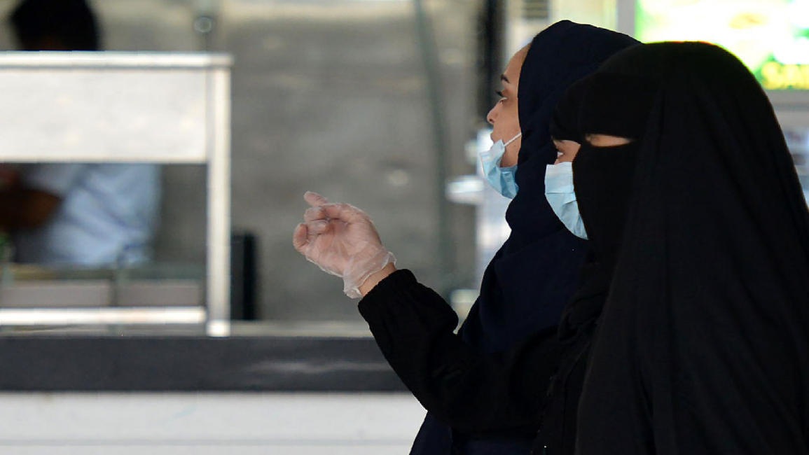 Saudi women wearing masks, gloves, Covid-19
