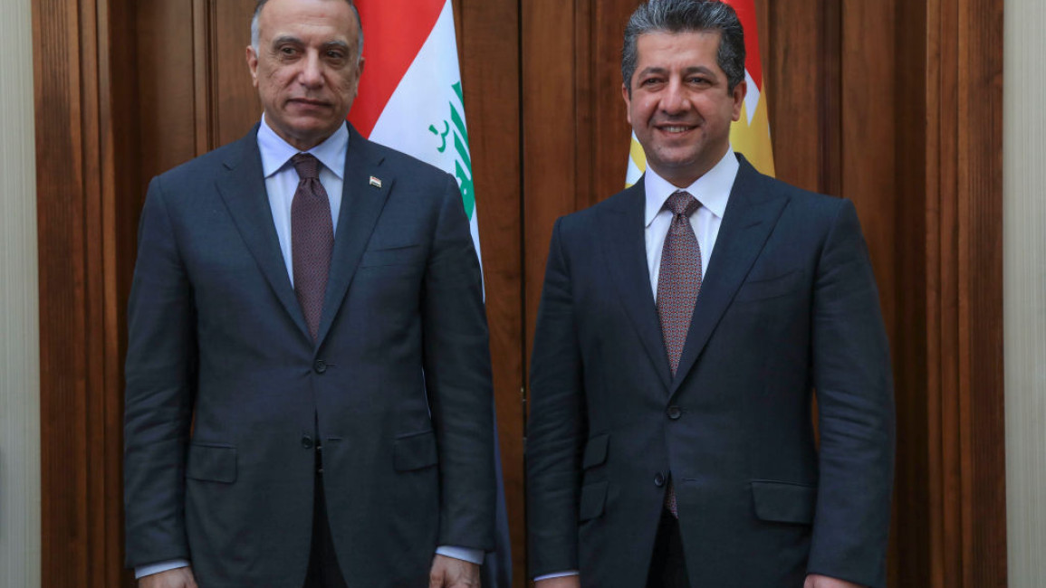 Prime Minister of the Regional Government of Iraqi Kurdistan Masrour Barzani (R) welcomes Iraqi Prime Minister Mustafa al-Kadhemi in Arbil