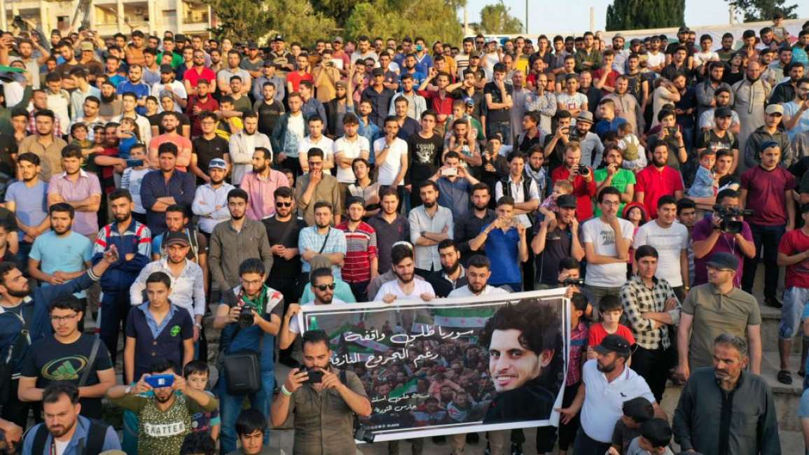 Residents of Idlib and refugees gathered to commemorate Abdel Basset Sarout [AFP]