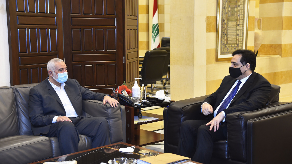  Lebanese Prime Minister Hassan Diab (R) receives Hamas political chief Ismail Haniyeh (L) in Beirut [Getty]