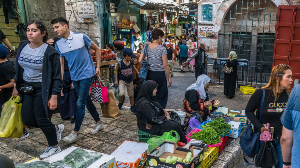A market in Jerusalem with Palestinians selling produce