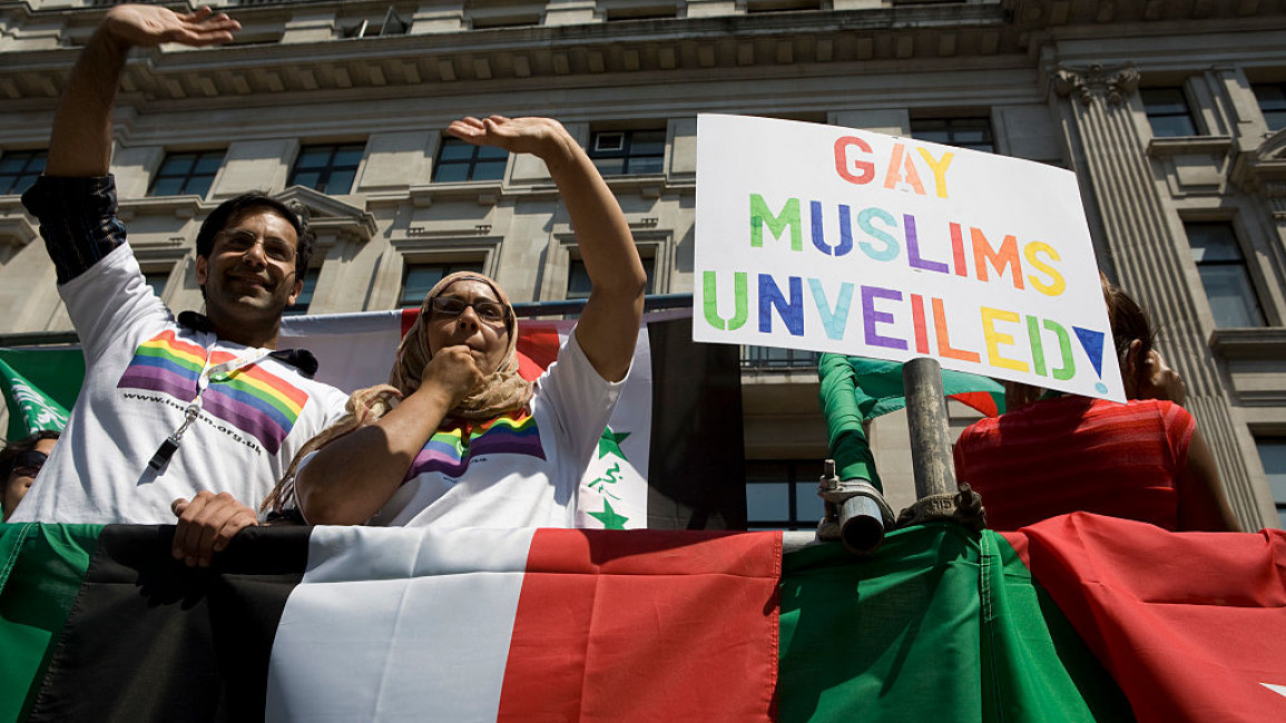 Members of the British gay, lesbian, bisexual, and transgender Muslim group Imaan wave from atop a float during the EuroPride parade in London on 6 July, 2019. [Getty]