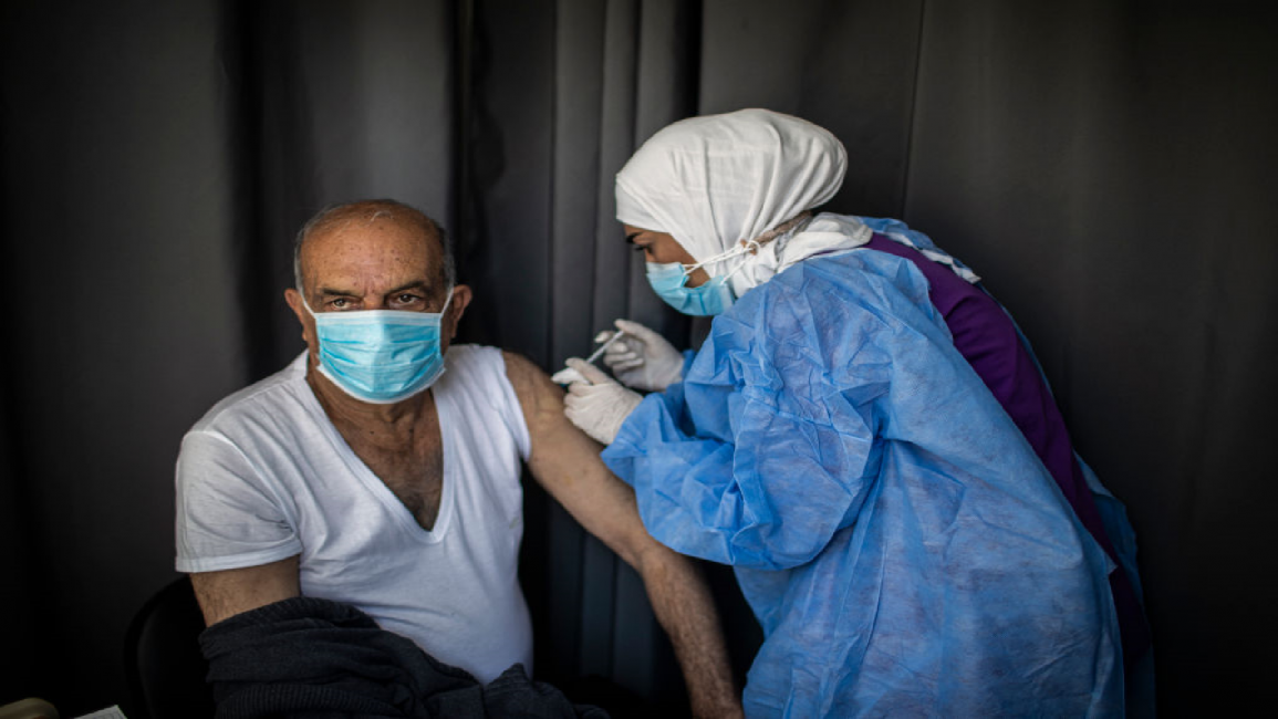 Man receives Pfizer vaccine in Lebanon