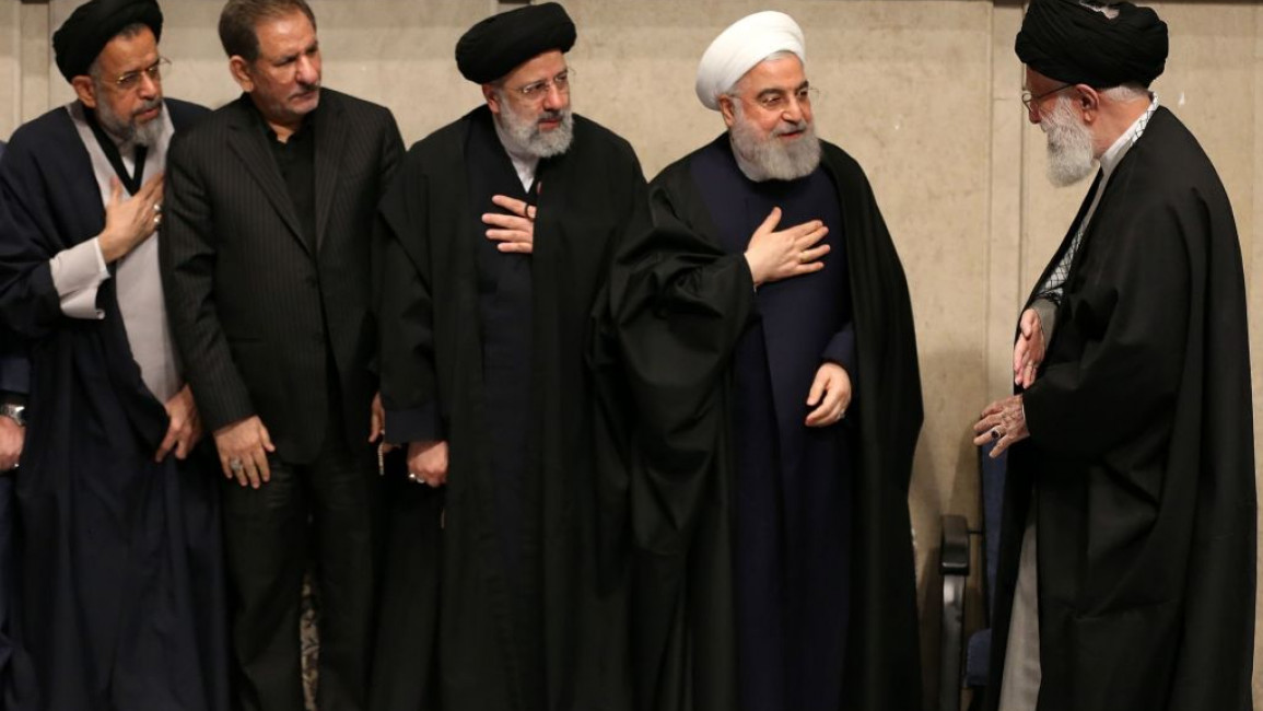 Iranian Supreme Leader Ayatollah Ali Khamenei (R) and Iranian President Ebrahim Raisi (middle) are threatened by demonstrations across the country. [Getty]