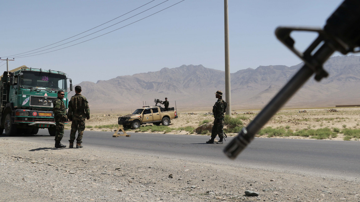 Afghan National Army stand guard at a checkpoint on the road near to the Bagram airfield in Kabul, Afghanistan [Getty]