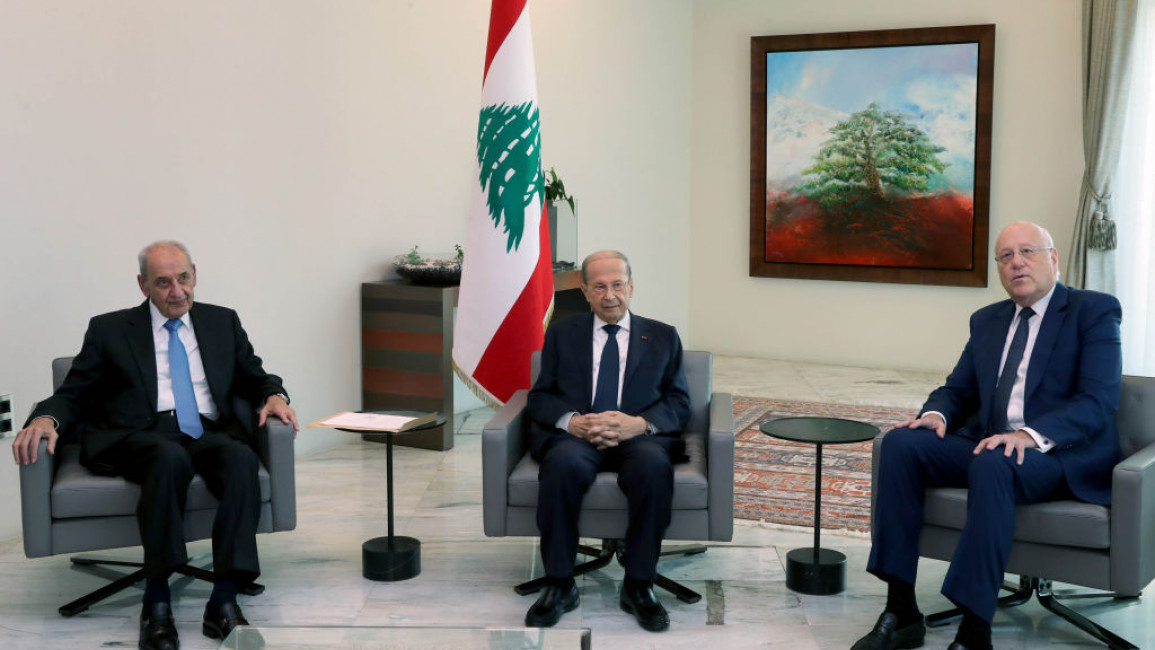 BEIRUT, LEBANON - JULY 26: (----EDITORIAL USE ONLY â MANDATORY CREDIT - "LEBANESE PRESIDENCY / HANDOUT" - NO MARKETING NO ADVERTISING CAMPAIGNS - DISTRIBUTED AS A SERVICE TO CLIENTS----) Lebanonâs president Michel Aoun (C) meets with former Prime Minister Najib Mikati at Baabda Palace in Beirut, Lebanon on July 26, 2021. Lebanonâs president picked Mikati to form a new government