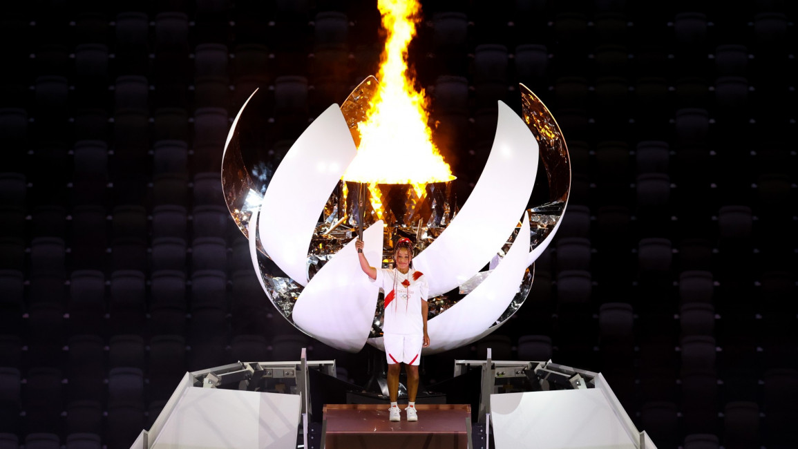  Tennis player Naomi Osaka lights the cauldron with the Olympic torch during the Opening Ceremony [Getty]