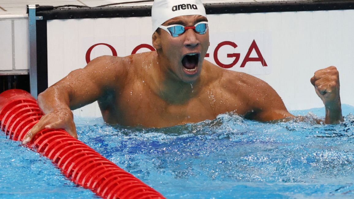 Ahmed Hafnaoui of Team Tunisia celebrates after winning the Men's 400m Freestyle Final on day two of the Tokyo 2020 Olympic Games at Tokyo Aquatics Centre on July 25, 2021 in Tokyo, Japan. (Photo by Tom Pennington/Getty Images)