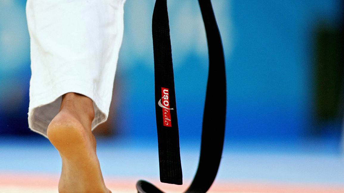 Athens, GREECE: A judoka's black belt is pictured during the women under 63 kg judo competition 17 August 2004 at the Ana Liosia Olympic Hall in Athens during the 2004 Olympic Games. AFP PHOTO FRANCK FIFE (Photo credit should read FRANCK FIFE/AFP via Getty Images)
