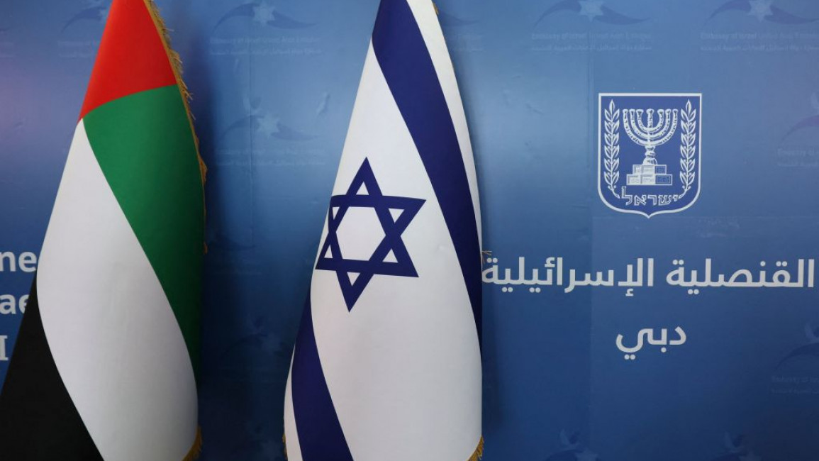 The national flags of the United Arab Emirates (L) and Israel, are set side by side at the new Israeli consulate of Dubai