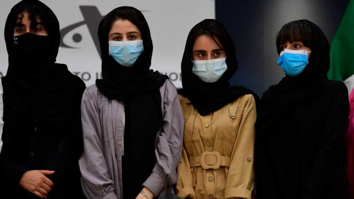 Four members of the Afghanistan Robotic team pose for a picture after arriving as refugees in Mexico City, on 24 August 2021. [Getty]