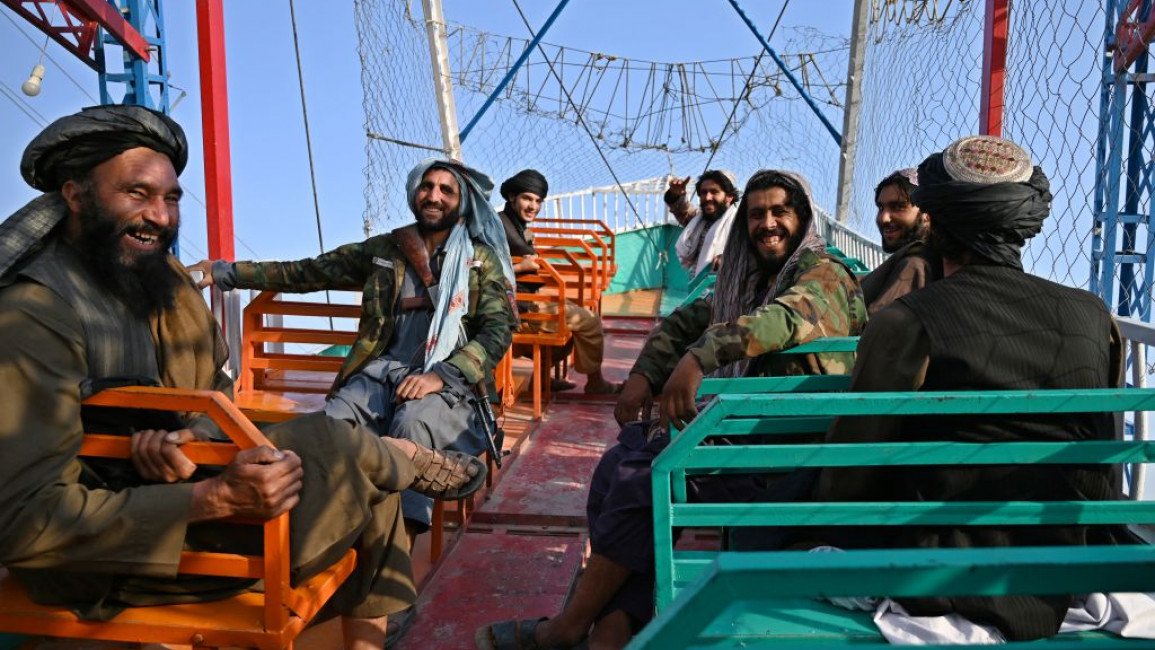 Taliban fighters enjoyed themselves on a pirate ship ride at the Kabul funfair [Getty]