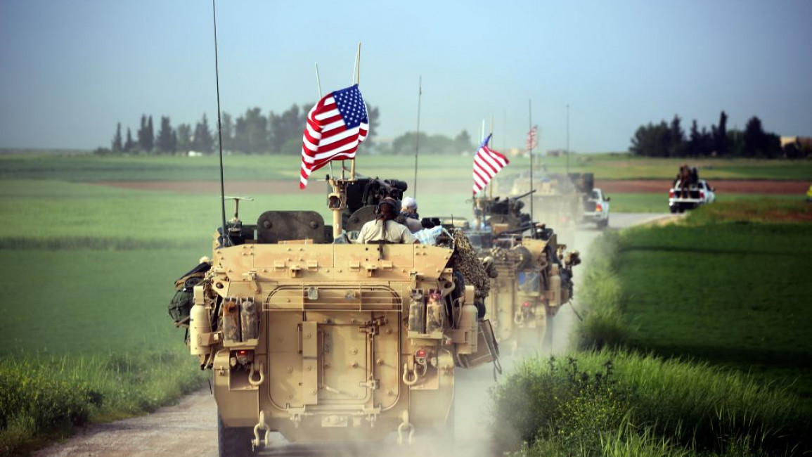 US forces, accompanied by Kurdish People's Protection Units (YPG) fighters, near the northern Syrian village of Darbasiyah, on the border with Turkey on 28 April 2017. [Getty]