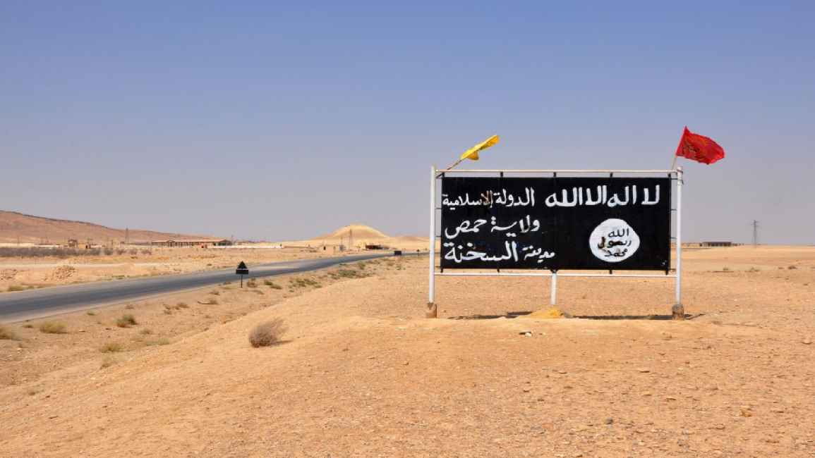 Islamic State (IS) group poster in the central Syrian town of Al-Sukhnah