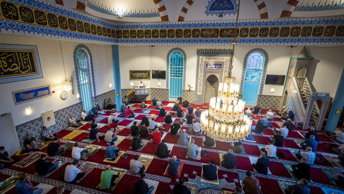 Muslims gather during morning prayers for Eid al-Adha at The Mevlana Mosque in Rotterdam [Getty[