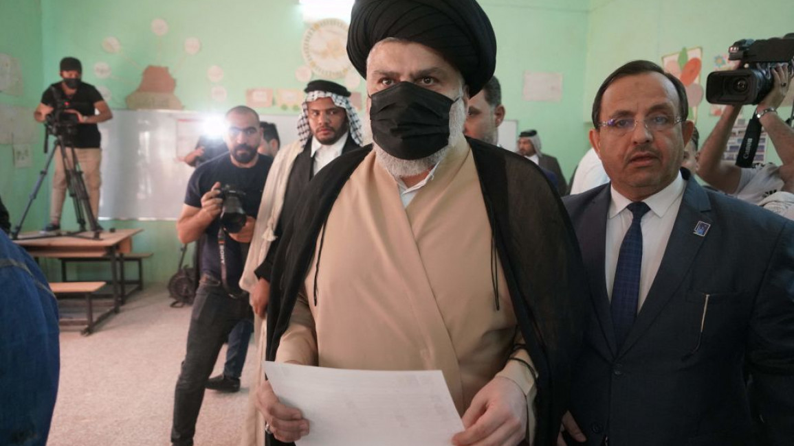 Iraq's populist cleric Moqtada Sadr prepares to vote at a polling station in the central Iraqi shrine city of Najaf.