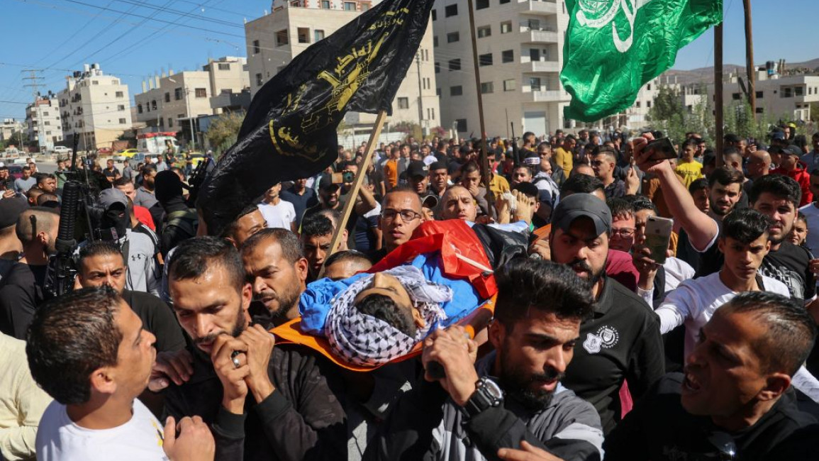 Palestinians carry the body of Mohammed Daadas