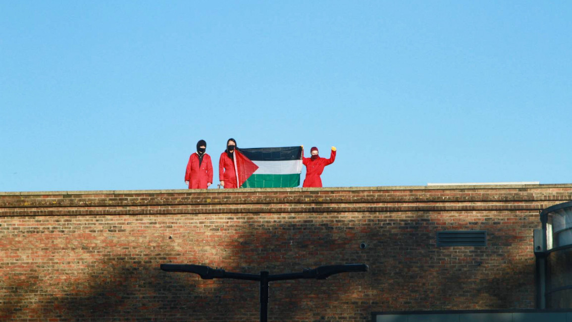 Militants of Palestine Action stand on the roof of Elbit's Bristol headquarters