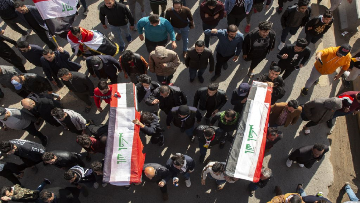Mock coffins of 2 Iraqi journalists killed in Basra
