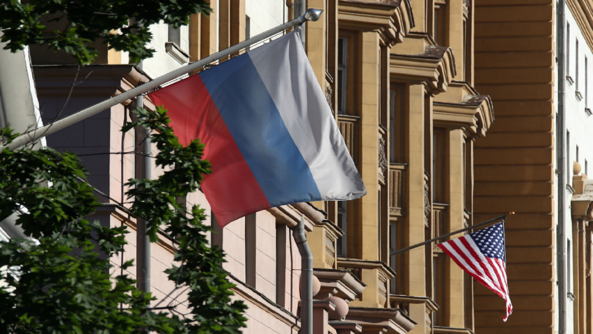 American flag flies outside US embassy in Moscow, close to a Russian flag