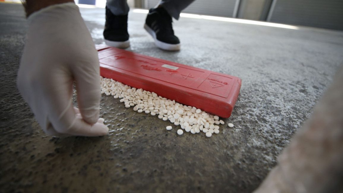 White Captagon pills on the floor