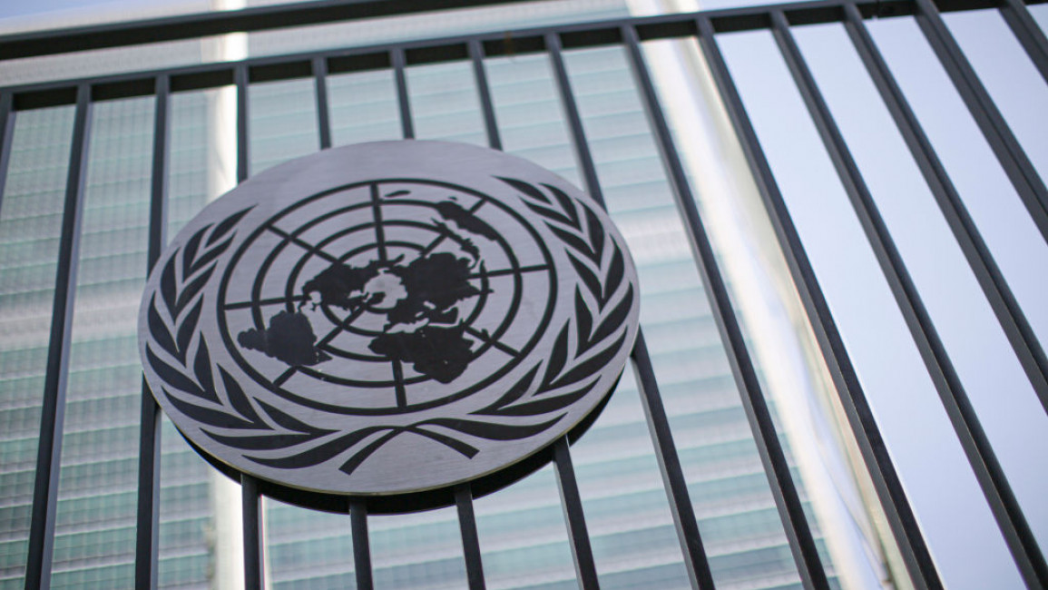 The United Nations' circular logo attached to a railing
