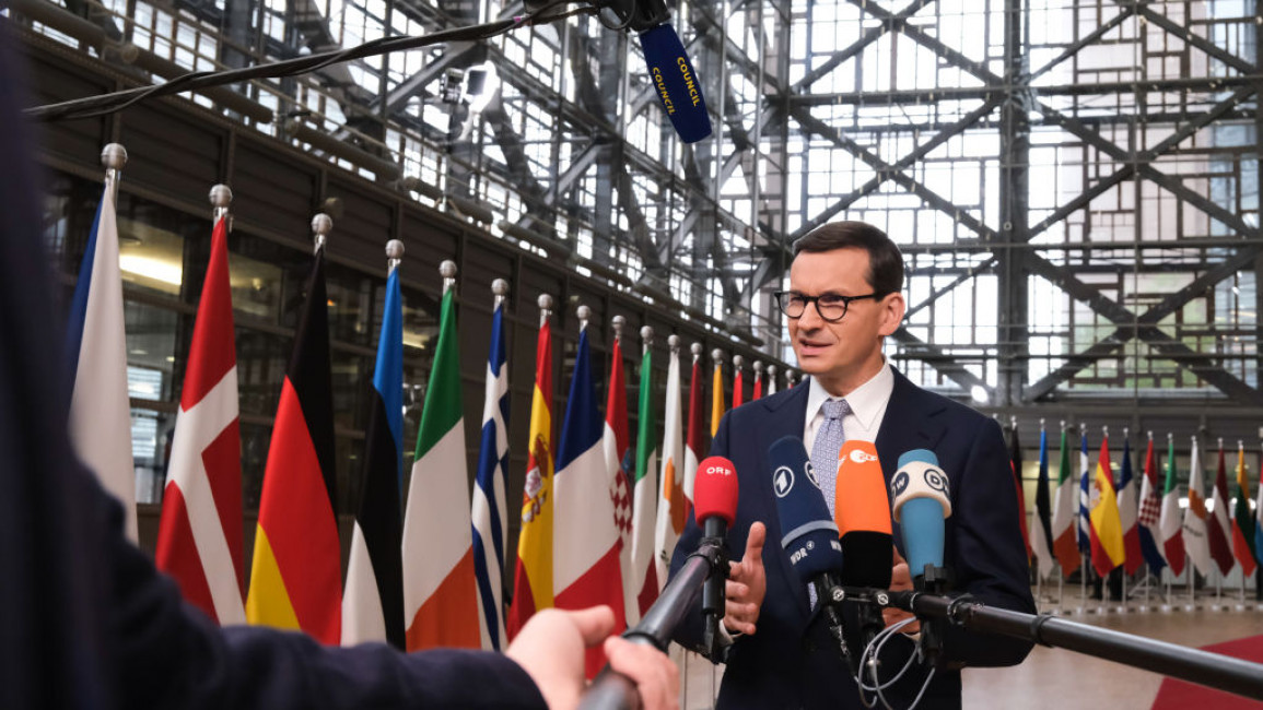 : Poland's Prime Minister Mateusz Morawiecki speaks to media as he attends the EU Leaders' Summit on October 21, 2021 in Brussels, Belgium.