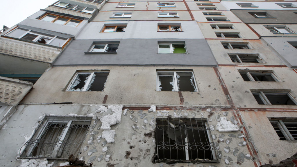 Damage done to a residential building is seen after shelling in Kharkiv