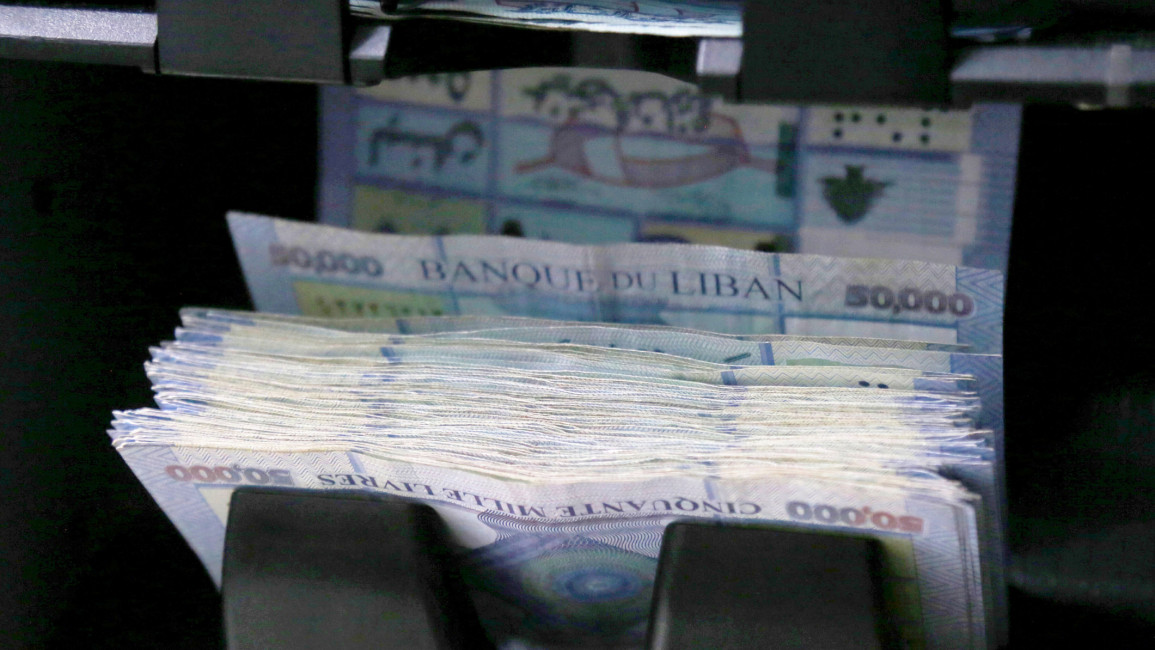 A counting machine counting 50,000 Lebanese pound banknotes
