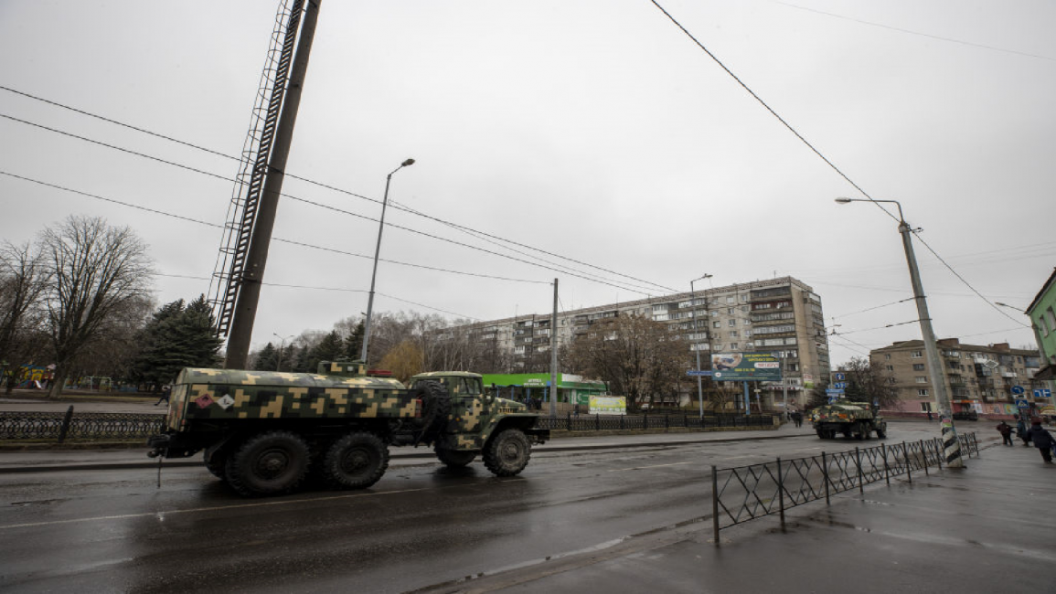 military vehicles Kramatorsk, UkraineMilitary vehicles move on a road in Kramatorsk city amid Russiaâs military intervention as explosions heard in eastern Ukraine's Donbas region on February 25, 2022. (Photo by Aytac Unal/Anadolu Agency via Getty Images)