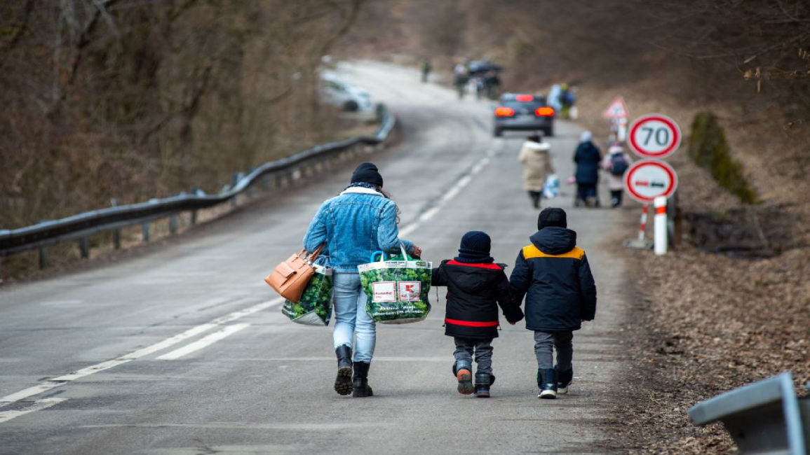 Woman and two children fleeing Ukraine